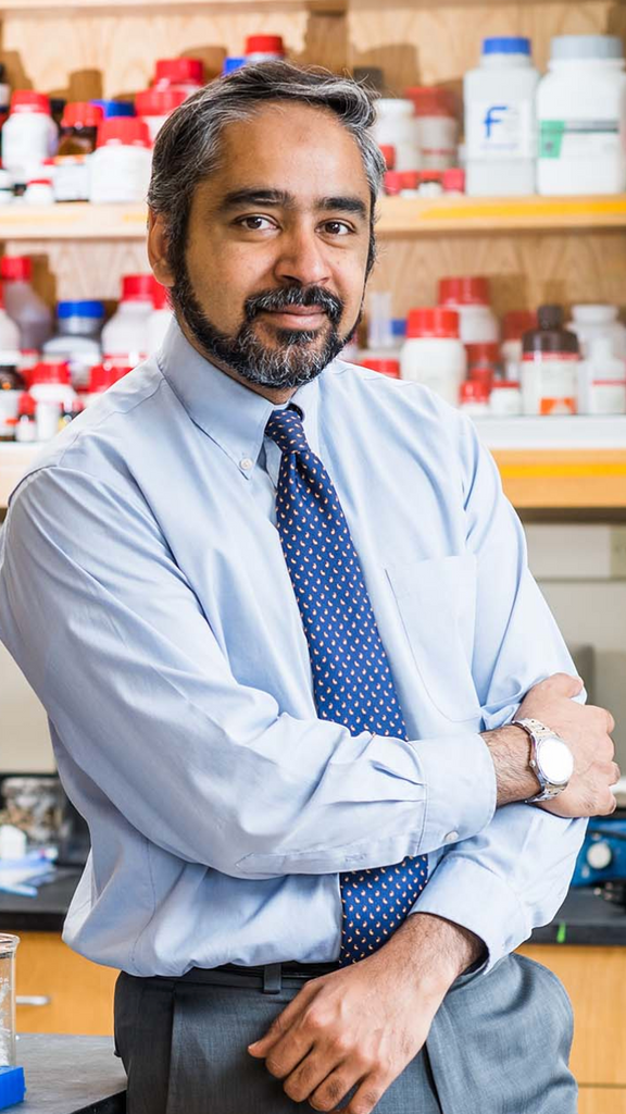 Photo: Formal portrait of a man wearing a tie and collared shirt